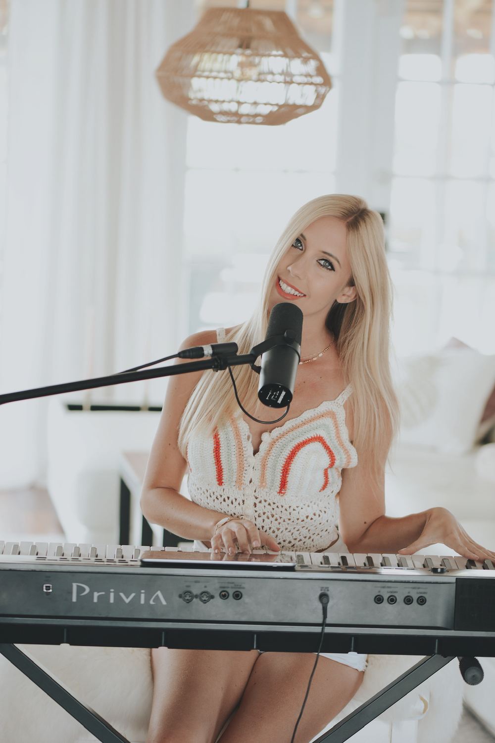 Joanna Holstein at the keyboard in a bright room